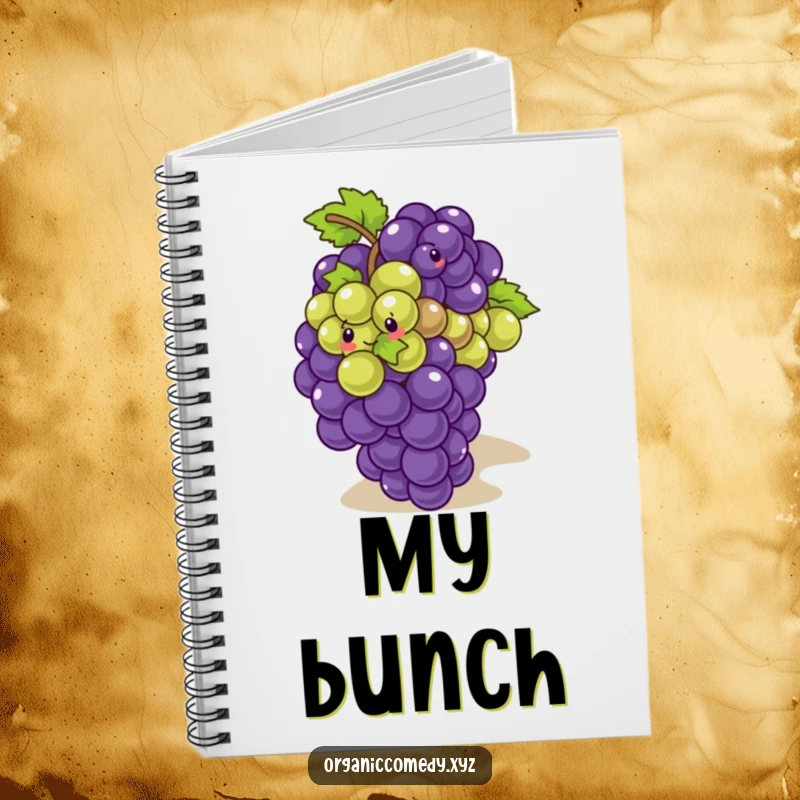 Funny, giggling bunch of grapes playfully tumbling down a slope, featured on a humorous notebook cover.